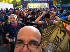TCS NYC Marathon finish with medal and runners